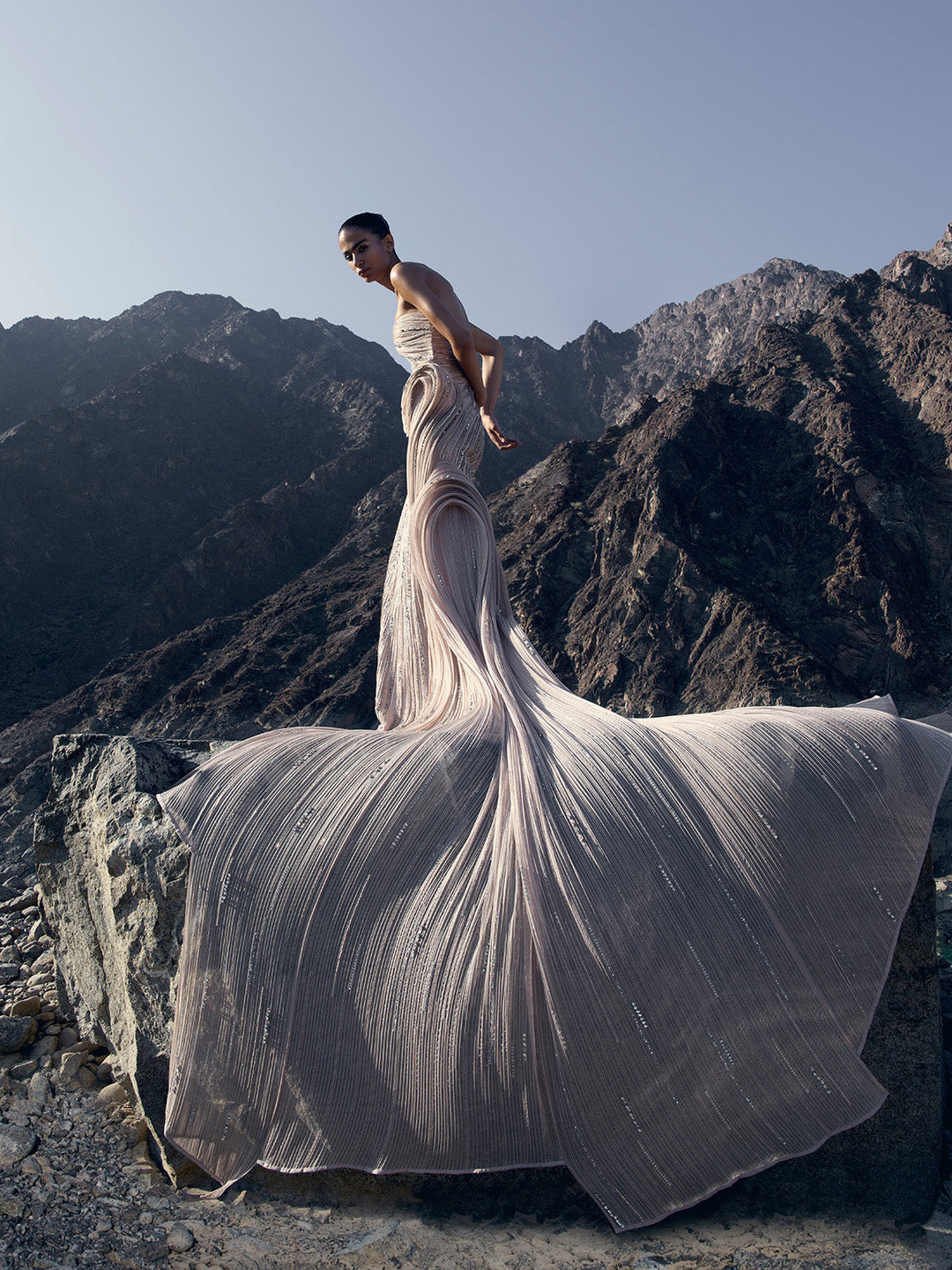 Model wearing silver sculpted gown by Gaurav Gupta