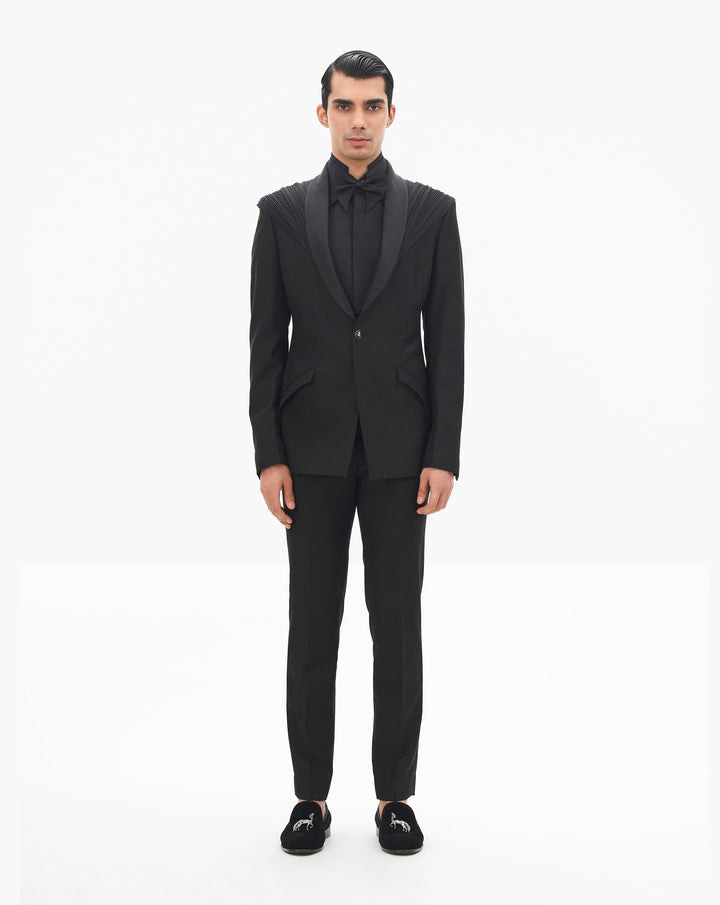 Model wearing a black tuxedo by Gaurav Gupta