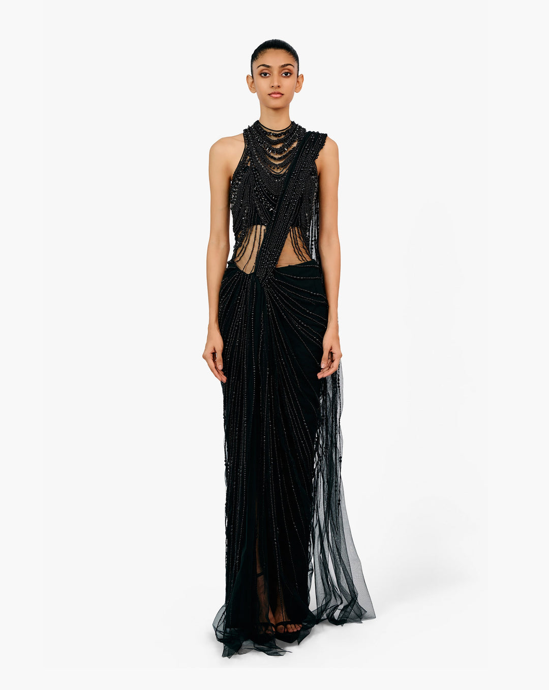 Woman wearing black embellished draped saree gown by Gaurav Gupta