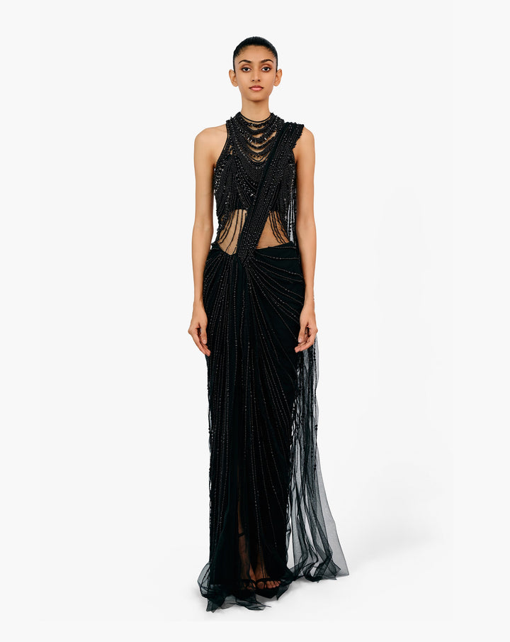 Woman wearing black embellished draped saree gown by Gaurav Gupta