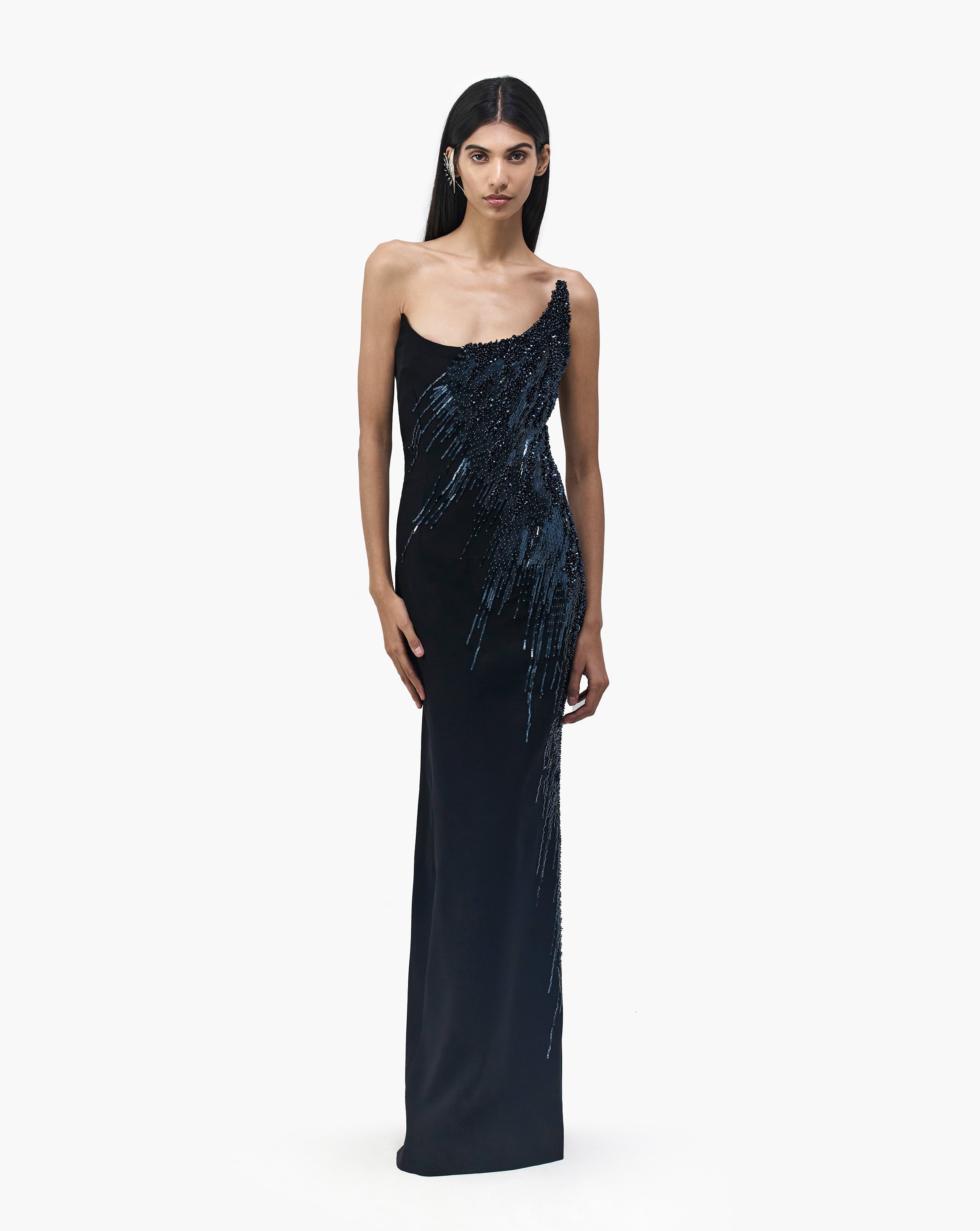 Front side view of model wearing black elegant dress by Gaurav Gupta