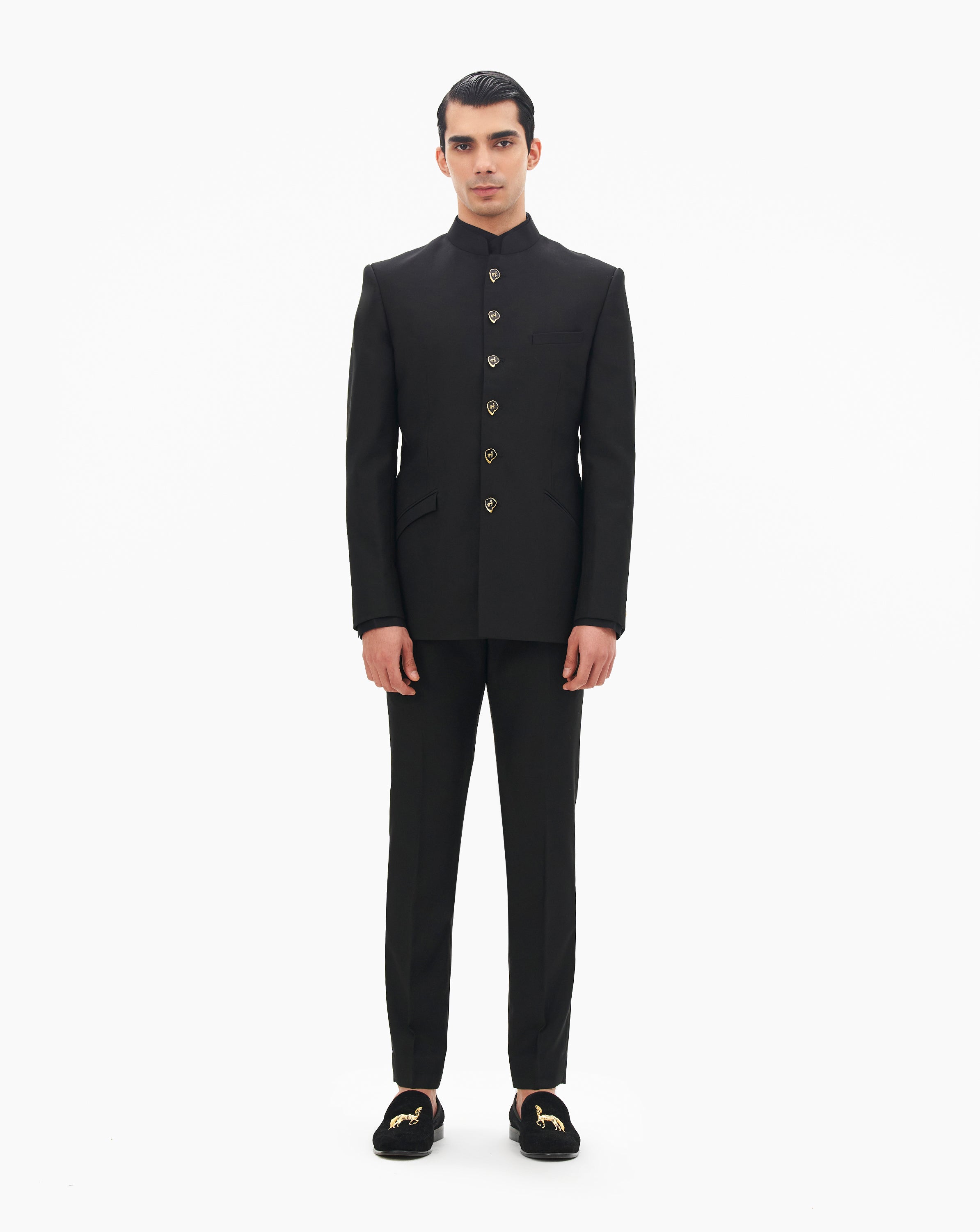 Model wearing black suit by Gaurav Gupta