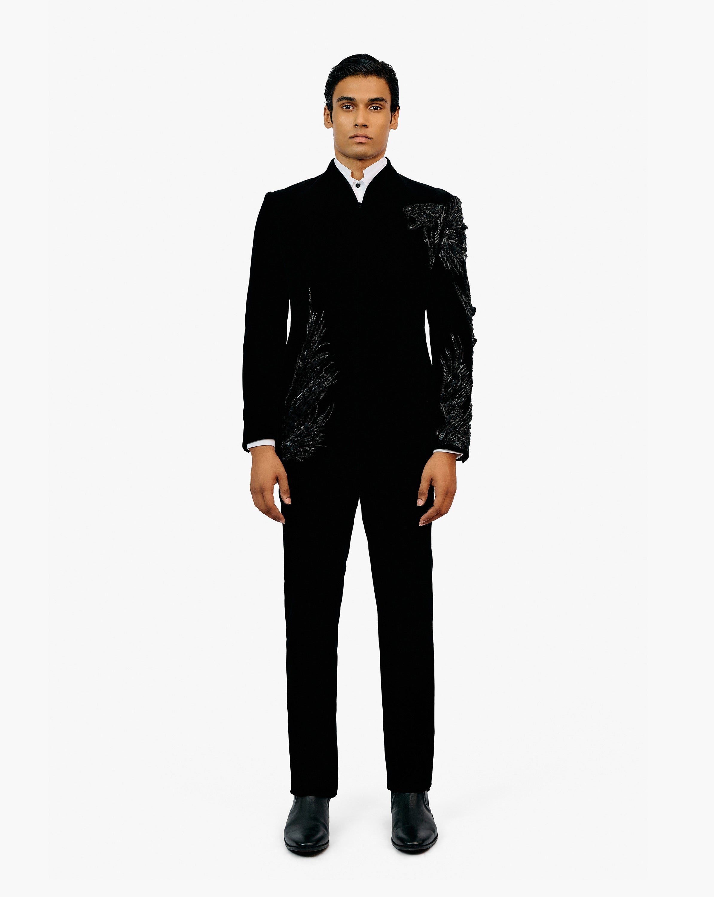 Model wearing black suit by Gaurav Gupta