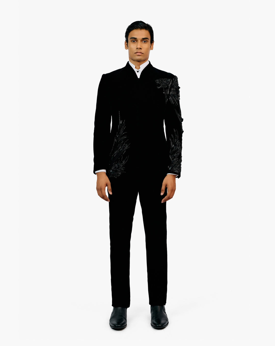 Model wearing black suit by Gaurav Gupta