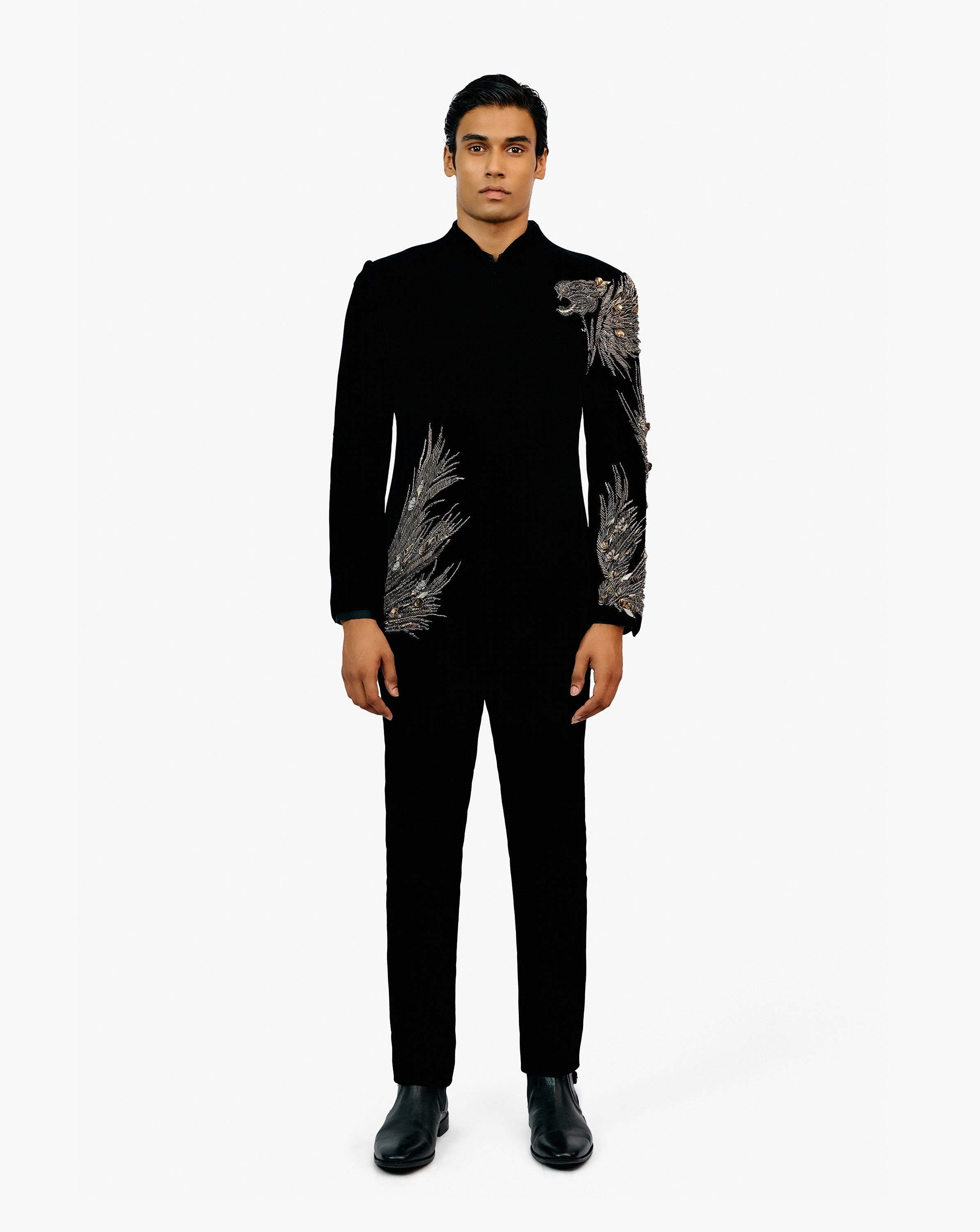 Model wearing a black embroidered sherwani set by Gaurav Gupta