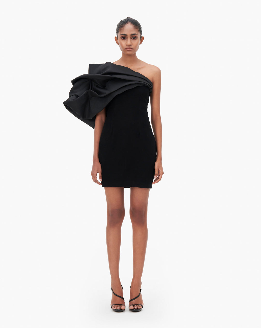 Model wearing black ruffle short dress by Gaurav Gupta