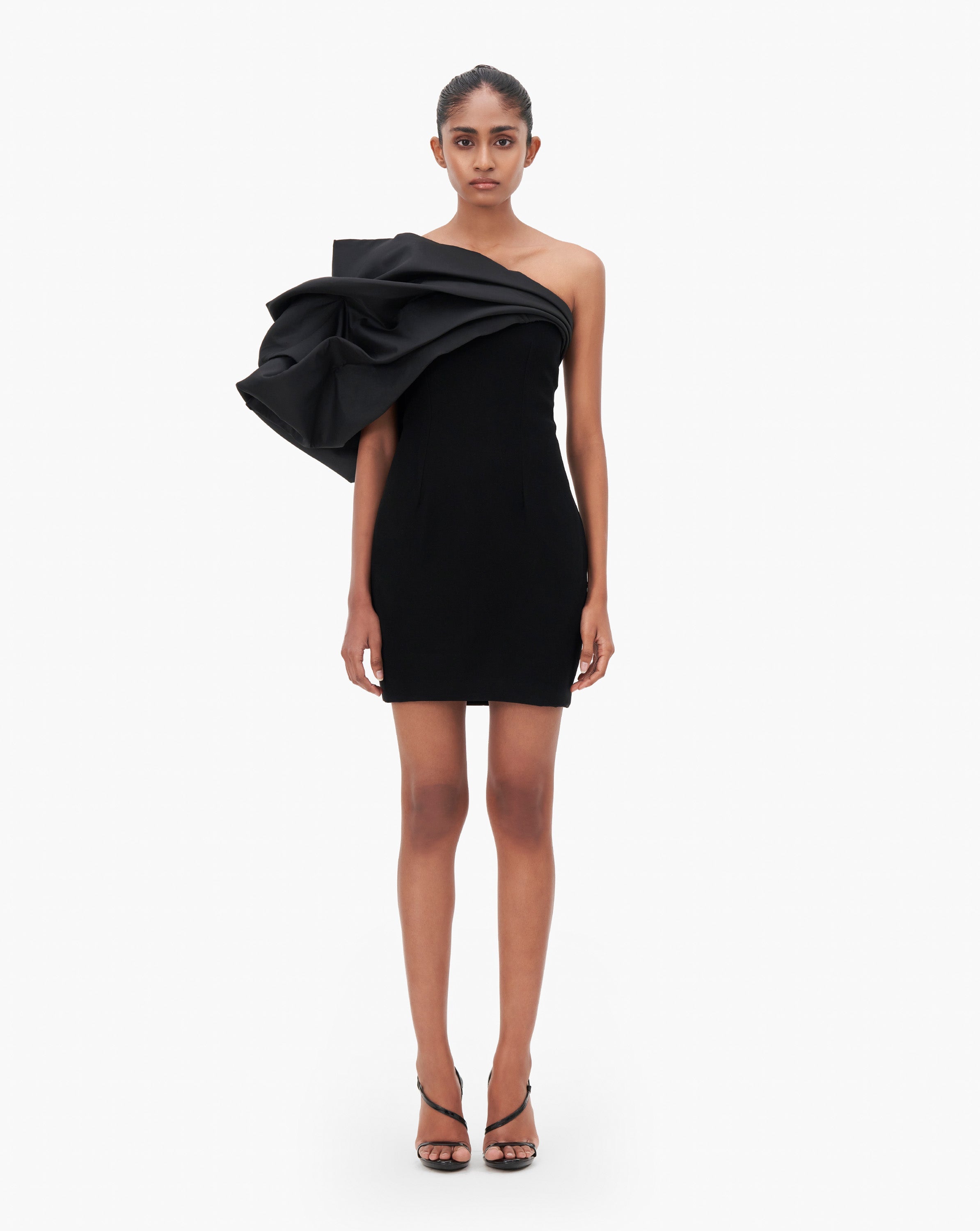 Model wearing black ruffle short dress by Gaurav Gupta